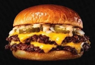 Double smash cheeseburger with pickles and onions